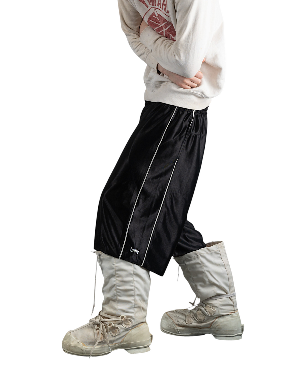 BULLY LA black raschel knit shorts with silver contrast piping and embroidered logo worn by a model