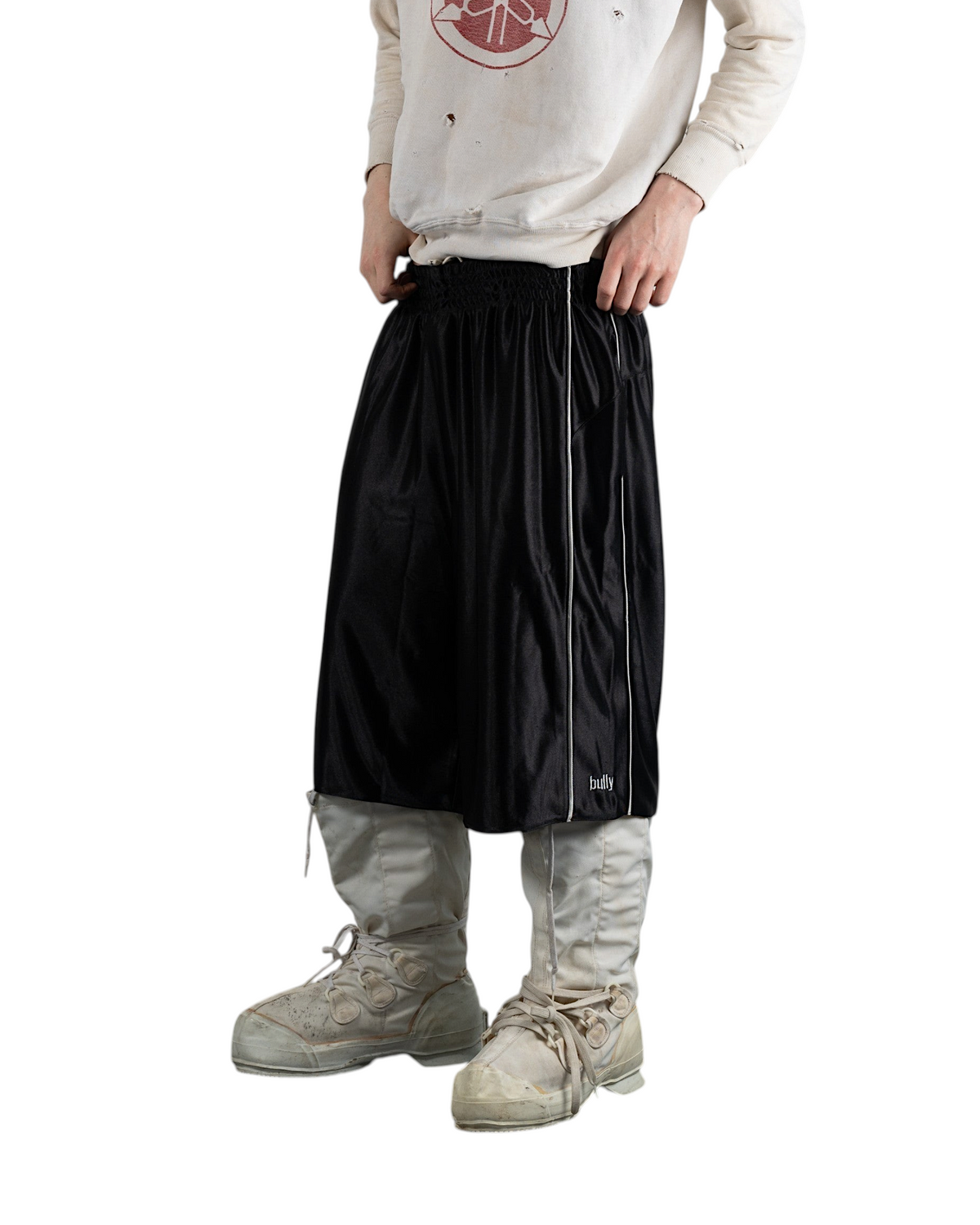BULLY LA black raschel knit polyester shorts with silver contrast piping and embroidered logo, worn by a male model.