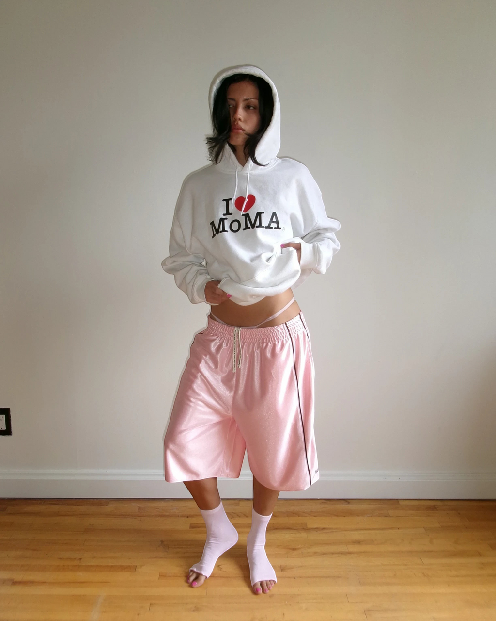 BULLY LA pink raschel knit polyester shorts with chocolate brown piping, side pockets, and embroidered logo details.