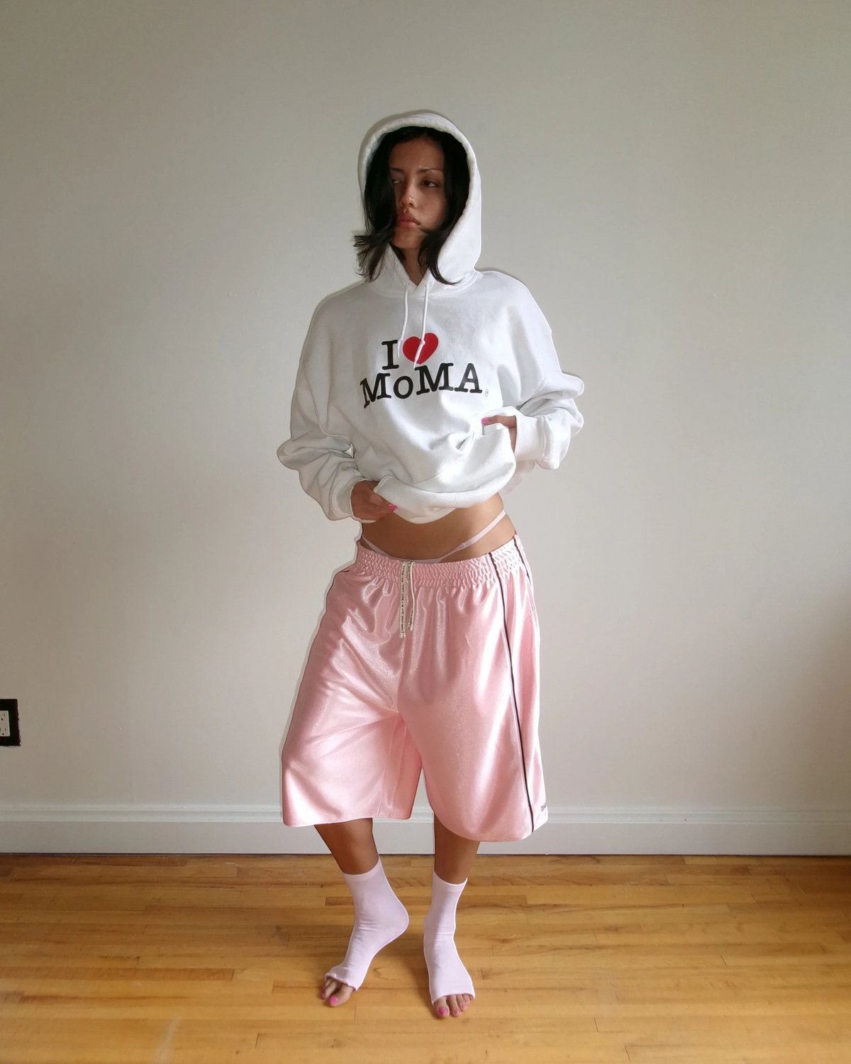 BULLY LA pink raschel knit polyester shorts with chocolate brown piping, side pockets, and embroidered logo details.